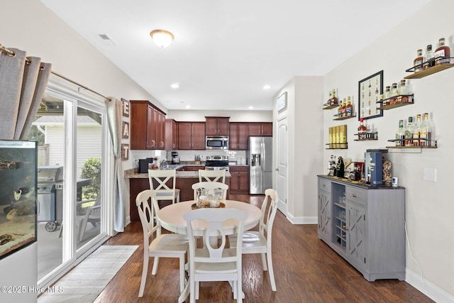 3243 Kellerton Pl, Wilmington, NC 28409 - dining area featuring dark wood-type flooring, a bar, and recessed lighting