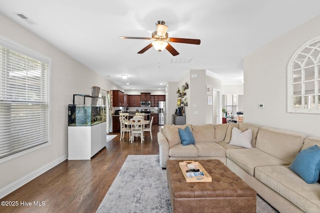 3243 Kellerton Pl, Wilmington, NC 28409 - living area featuring dark wood-type flooring, ceiling fan, and healthy amount of natural light
