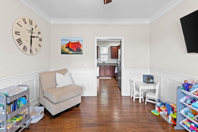 3243 Kellerton Pl, Wilmington, NC 28409 - playroom featuring crown molding, a wainscoted wall, and dark wood-style floors