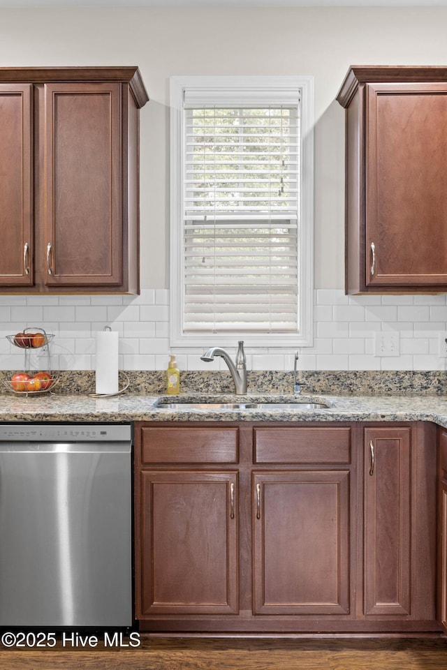 3243 Kellerton Pl, Wilmington, NC 28409 - kitchen with stainless steel dishwasher, decorative backsplash, and light stone countertops