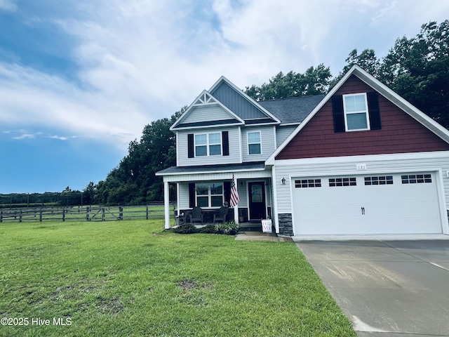 121 Woodwater Dr, Richlands, NC 28574 - craftsman-style house with covered porch, concrete driveway, and stone siding
