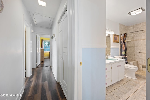 304 N Main St, Colerain, NC 27924 - hall featuring attic access and light wood-style floors