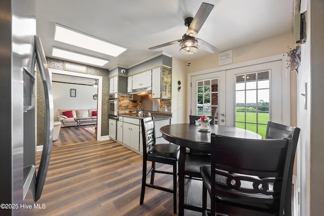 304 N Main St, Colerain, NC 27924 - dining space with dark wood-style floors, ceiling fan, and french doors