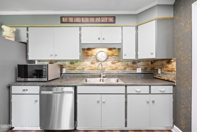 304 N Main St, Colerain, NC 27924 - kitchen with stainless steel appliances, dark countertops, ornamental molding, backsplash, and white cabinetry