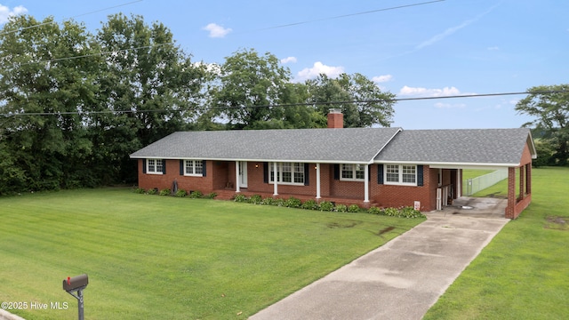 304 N Main St, Colerain, NC 27924 - single story home featuring a chimney, driveway, a front yard, brick siding, and roof with shingles