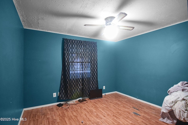 1311 Hazel Ave, New Bern, NC 28560 - empty room with wood finished floors, a textured ceiling, and ceiling fan