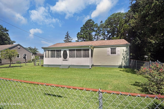 1311 Hazel Ave, New Bern, NC 28560 - rear view of property with a sunroom, a fenced backyard, and roof with shingles
