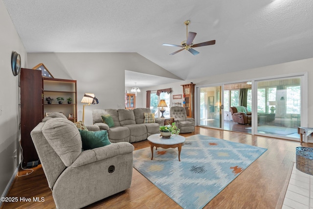 115 Baker Cir W, End, NC 27376 - living room with plenty of natural light, a ceiling fan, vaulted ceiling, a textured ceiling, and wood finished floors