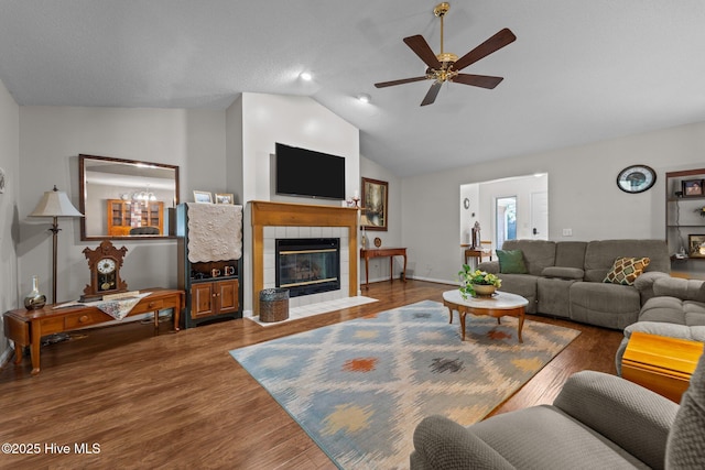 115 Baker Cir W, End, NC 27376 - living room featuring a tile fireplace, lofted ceiling, ceiling fan, and wood finished floors