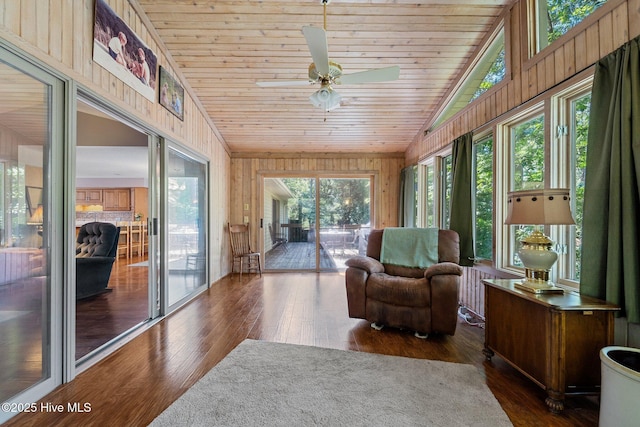 115 Baker Cir W, End, NC 27376 - sunroom with vaulted ceiling, wooden ceiling, wood-type flooring, and wood walls