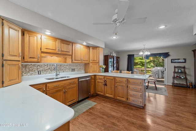 115 Baker Cir W, End, NC 27376 - kitchen with stainless steel dishwasher, a peninsula, light countertops, a ceiling fan, and a textured ceiling
