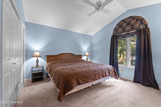 115 Baker Cir W, End, NC 27376 - bedroom with carpet floors, a closet, lofted ceiling, and a ceiling fan