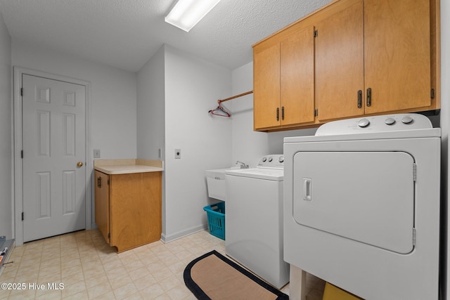 115 Baker Cir W, End, NC 27376 - washroom featuring cabinet space, washer and clothes dryer, and a textured ceiling