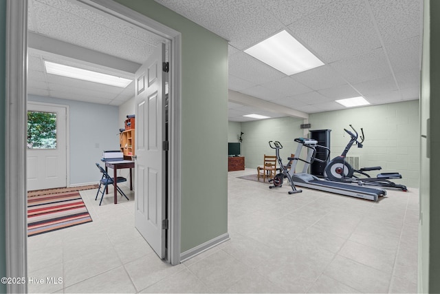 115 Baker Cir W, End, NC 27376 - exercise room featuring a paneled ceiling, concrete block wall, and light tile patterned floors