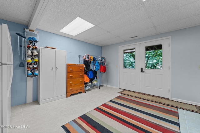 115 Baker Cir W, End, NC 27376 - entryway featuring concrete block wall and light tile patterned floors