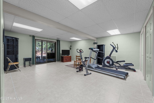 115 Baker Cir W, End, NC 27376 - workout area with a drop ceiling, concrete block wall, and tile patterned flooring