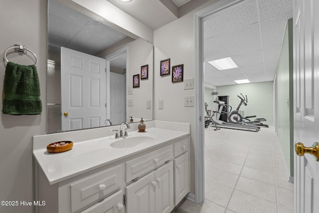 115 Baker Cir W, End, NC 27376 - bathroom featuring vanity, a drop ceiling, and tile patterned flooring