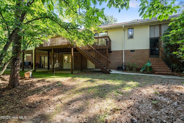 115 Baker Cir W, End, NC 27376 - back of house with stairs, a wooden deck, and brick siding