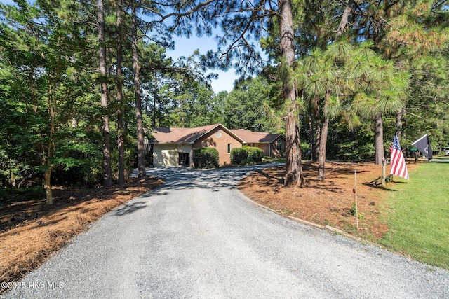 115 Baker Cir W, End, NC 27376 - ranch-style house featuring curved driveway and a front yard