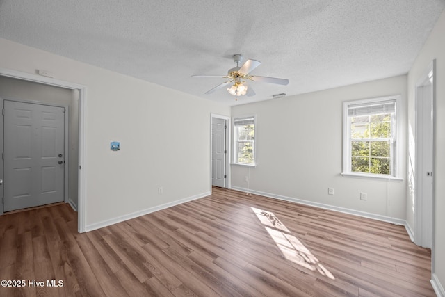 108 Bayswater Ct, New Bern, NC 28562 - unfurnished room with a textured ceiling, wood finished floors, and ceiling fan