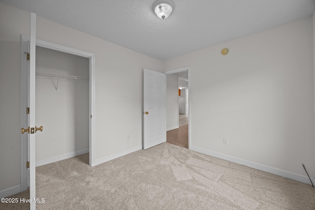 1218 Early Station Rd, Aulander, NC 27805 - unfurnished bedroom featuring carpet floors, a textured ceiling, and a closet