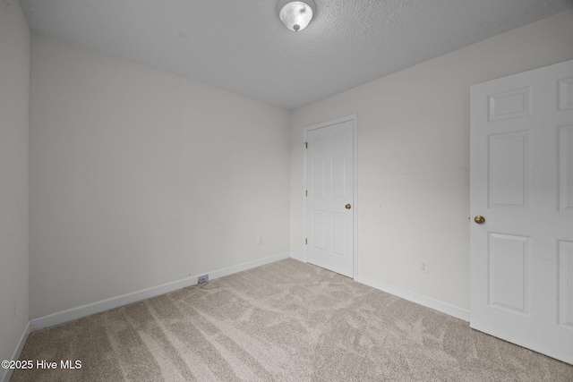 1218 Early Station Rd, Aulander, NC 27805 - carpeted empty room with baseboards and a textured ceiling