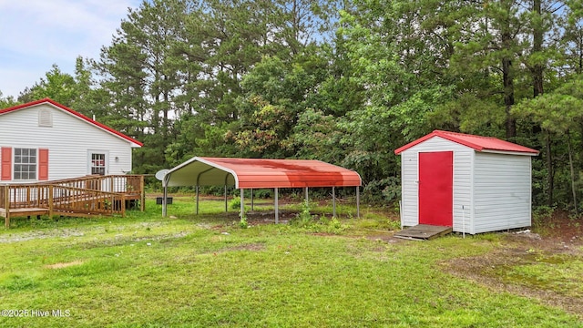 1218 Early Station Rd, Aulander, NC 27805 - view of green lawn featuring a storage shed, a detached carport, a deck, and view of scattered trees