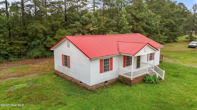 1218 Early Station Rd, Aulander, NC 27805 - view of front facade with crawl space, a front lawn, and a metal roof