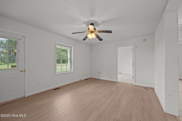 1218 Early Station Rd, Aulander, NC 27805 - unfurnished room with a ceiling fan, light wood finished floors, and a textured ceiling