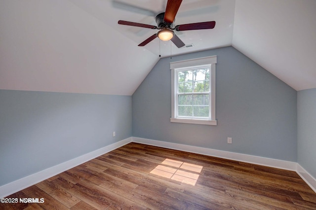 700 Bertram Ct, Hampstead, NC 28443 - bonus room with wood finished floors, a ceiling fan, and vaulted ceiling