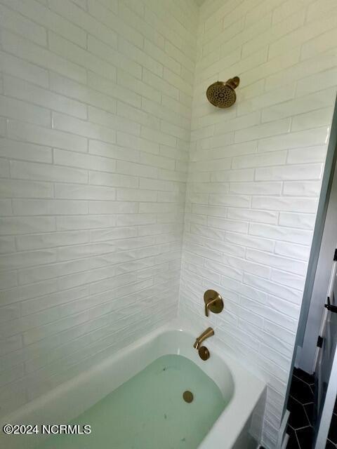 700 Bertram Ct, Hampstead, NC 28443 - full bathroom featuring shower / bathtub combination
