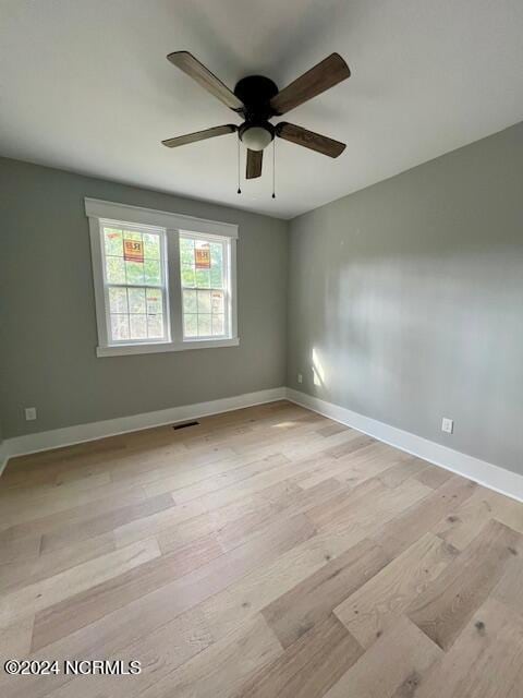 700 Bertram Ct, Hampstead, NC 28443 - spare room with light wood-style floors and ceiling fan