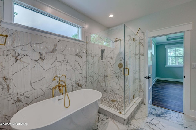 700 Bertram Ct, Hampstead, NC 28443 - full bath with plenty of natural light, a freestanding bath, a marble finish shower, marble finish floors, and recessed lighting