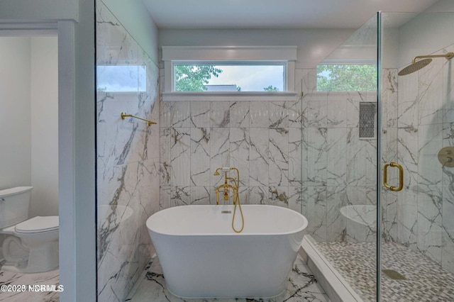 700 Bertram Ct, Hampstead, NC 28443 - full bath featuring marble tiled floors, a soaking tub, healthy amount of natural light, and tile walls