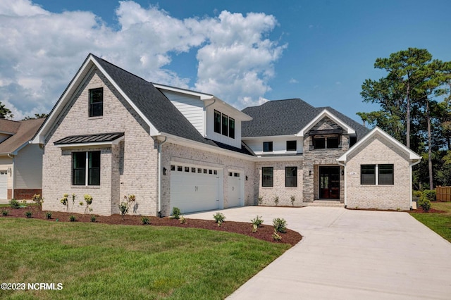 700 Bertram Ct, Hampstead, NC 28443 - view of front of property featuring driveway, brick siding, a front yard, and a garage