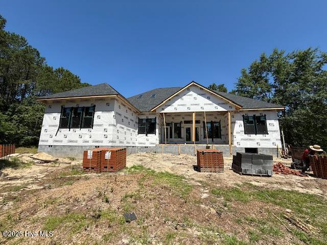 700 Bertram Ct, Hampstead, NC 28443 - rear view of house with a sunroom