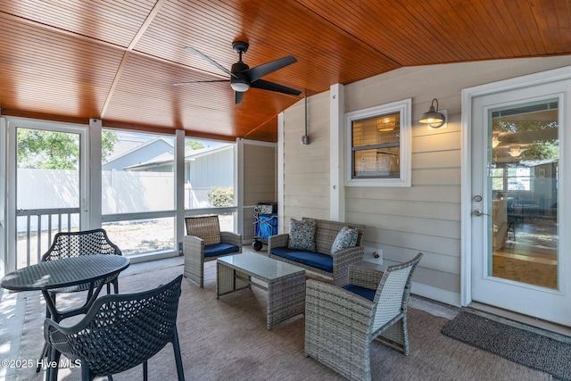 125 NE 13th St, Oak Island, NC 28465 - sunroom with lofted ceiling, ceiling fan, and outdoor lounge area