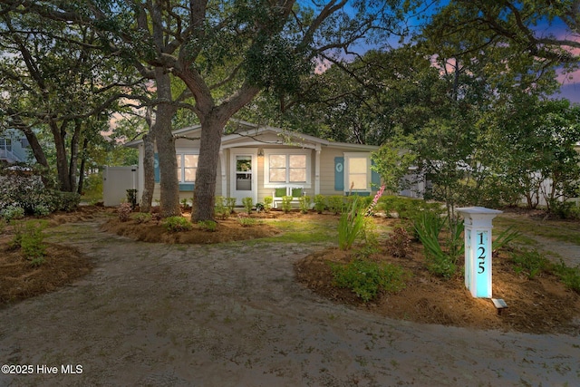 125 NE 13th St, Oak Island, NC 28465 - view of front of home with driveway