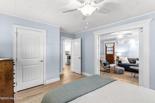 125 NE 13th St, Oak Island, NC 28465 - bedroom with crown molding, wood finished floors, and ceiling fan