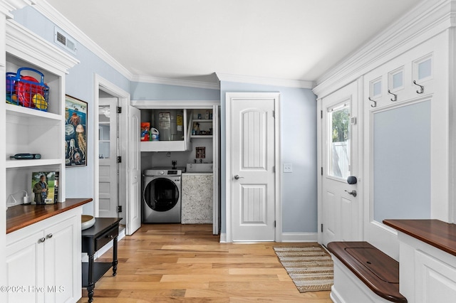125 NE 13th St, Oak Island, NC 28465 - washroom with separate washer and dryer, crown molding, and light wood finished floors