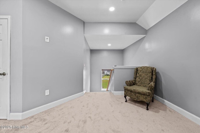 621 Longleaf Rd, Aberdeen, NC 28315 - sitting room with carpet floors, vaulted ceiling, and an upstairs landing