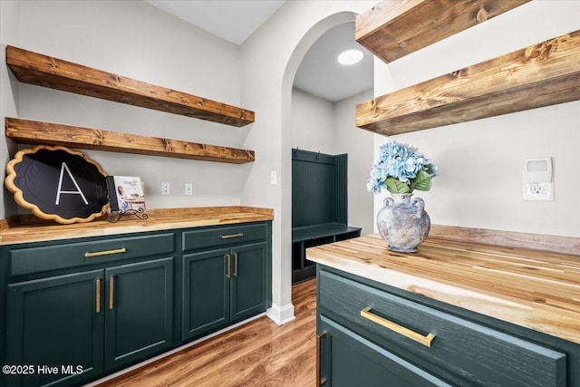 621 Longleaf Rd, Aberdeen, NC 28315 - bar featuring light wood-style floors and arched walkways