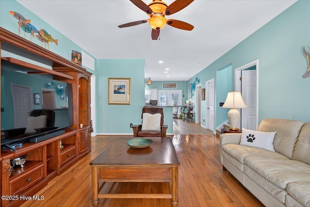 104 NE 27th St, Oak Island, NC 28465 - living room with a ceiling fan, light wood-style floors, and recessed lighting