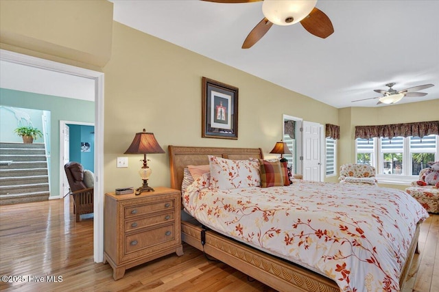 104 NE 27th St, Oak Island, NC 28465 - bedroom with light wood finished floors and ceiling fan