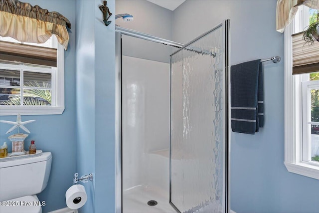 104 NE 27th St, Oak Island, NC 28465 - full bathroom with a stall shower and healthy amount of natural light