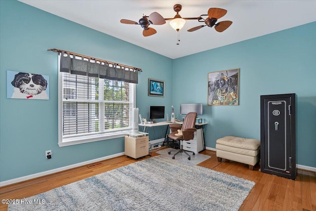 104 NE 27th St, Oak Island, NC 28465 - home office featuring ceiling fan and wood finished floors