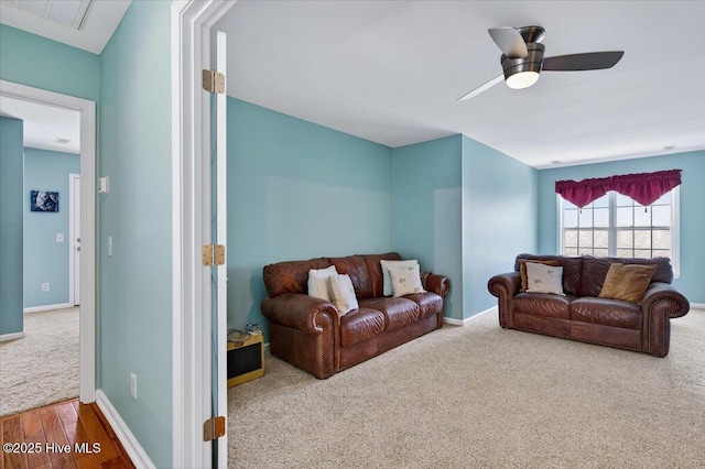 104 NE 27th St, Oak Island, NC 28465 - living area with carpet flooring and ceiling fan