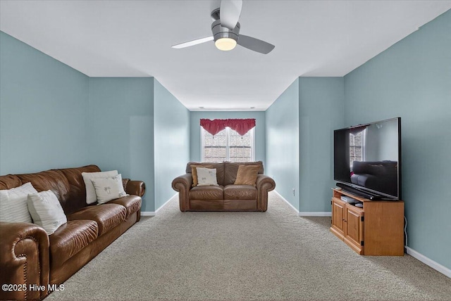 104 NE 27th St, Oak Island, NC 28465 - carpeted living room featuring ceiling fan and baseboards