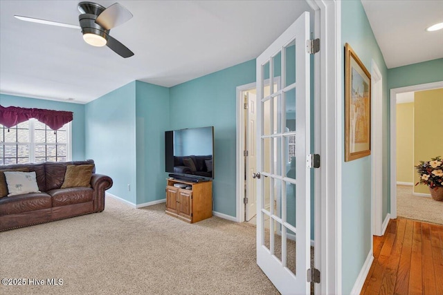 104 NE 27th St, Oak Island, NC 28465 - carpeted living area with baseboards and ceiling fan
