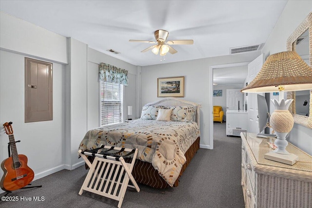 104 NE 27th St, Oak Island, NC 28465 - carpeted bedroom featuring electric panel and ceiling fan